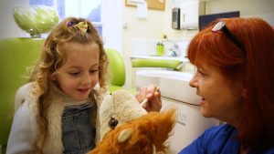 Dental Nurse with child photograph